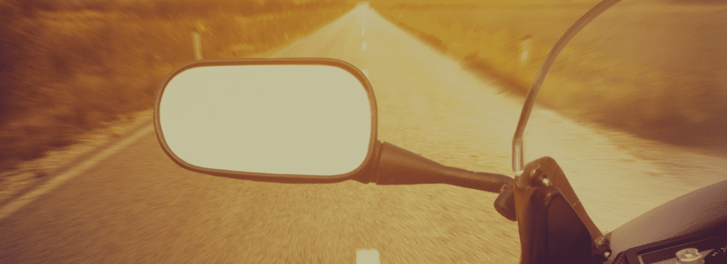 A rear view mirror of a motorbike
