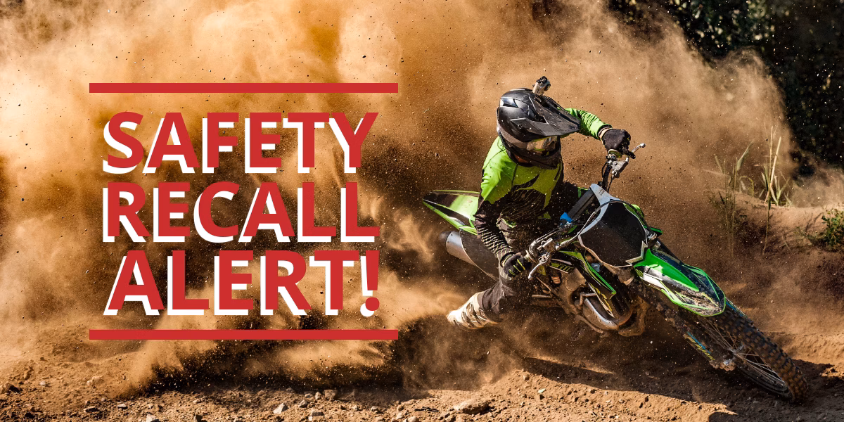 Recalled KTM Dirt Bikes – Front Brake Caliper Defect Poses Serious Crash Risk An off-road dirt bike rider skids through dirt with dust cloud, paired with bold red text reading “Safety Recall Alert”
