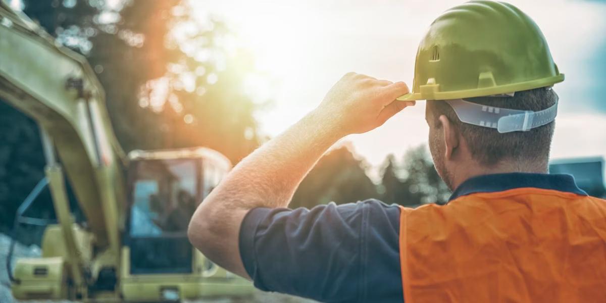 kansas-city-third-party-work-injury Construction worker wearing a hard hat and safety vest at a job site in Kansas City, representing potential third-party liability in workplace injury claims.